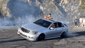 Drifting idiots in silver AMG Mercedes