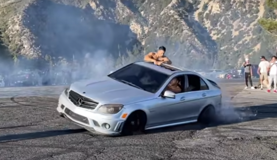 Drifting idiots in silver AMG Mercedes