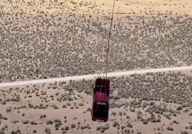 Toyota HiLux hanging from helicopter