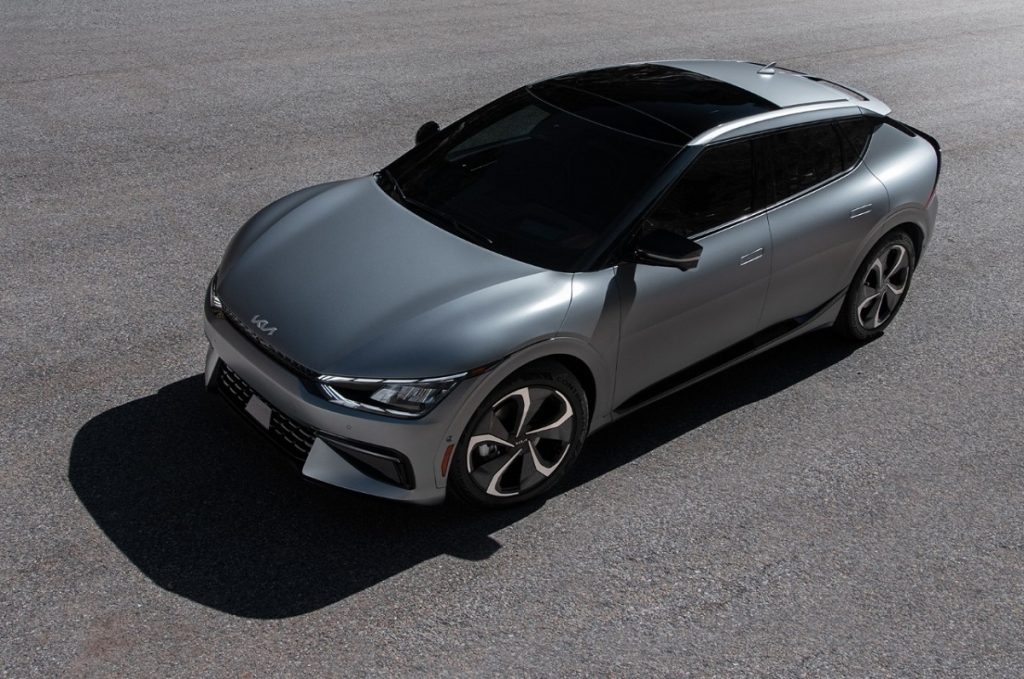 An aerial shot of a silver 2022 Kia EV6 in a parking lot.