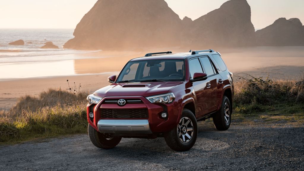 A red 2021 Toyota 4Runner parked near the beach 