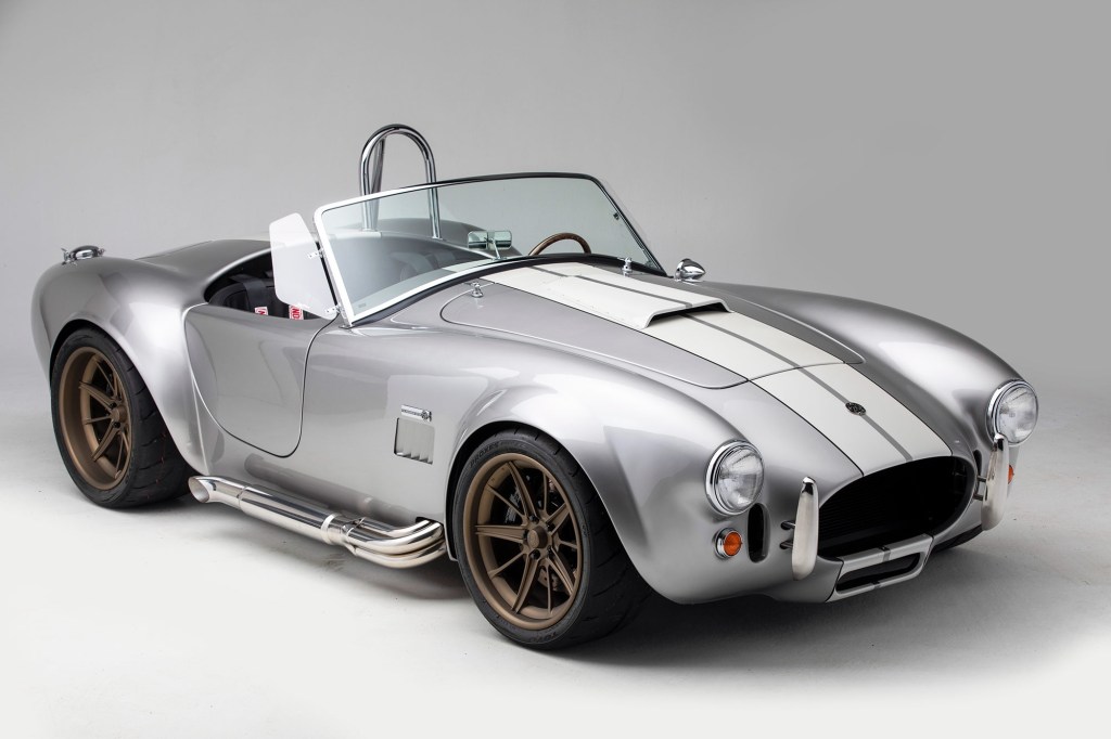 A silver-with-white-stripes Factory Five Racing Mk4 Roadster 25th Anniversary Shelby Cobra 427 replica kit car