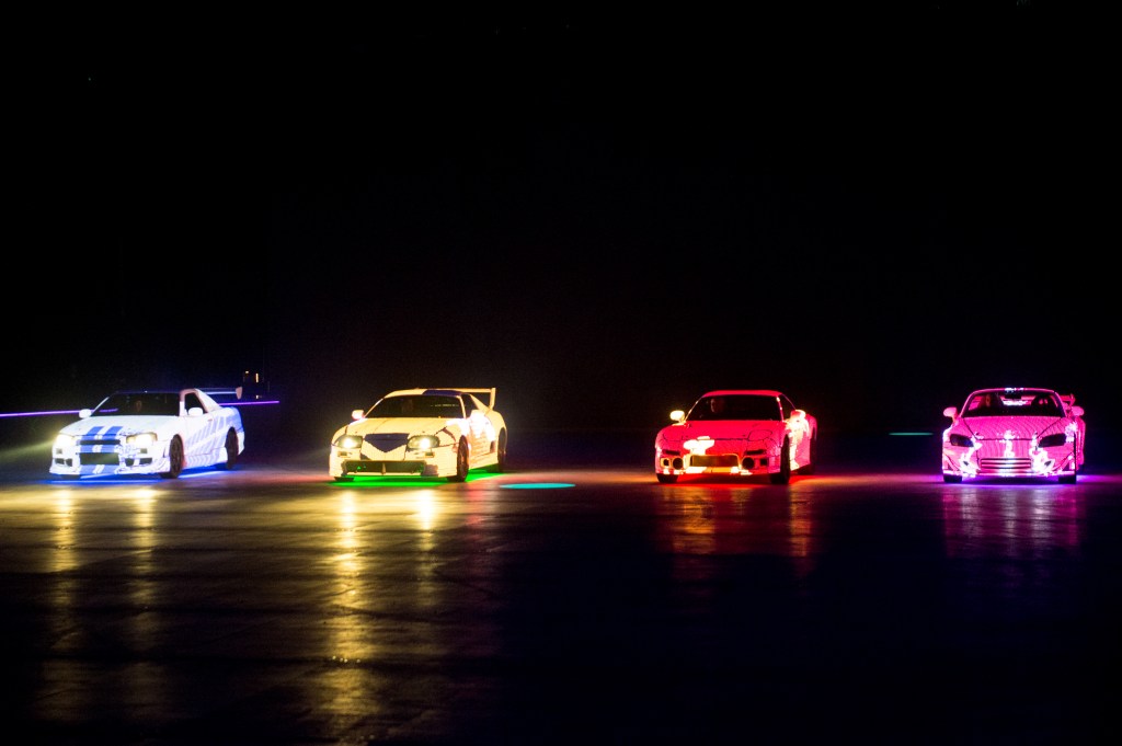 Four cars prepare for a Fast & Furious Live performance