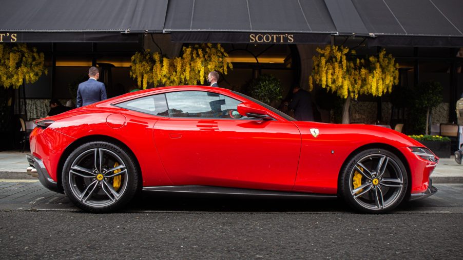 The red Ferrari Roma is based on the Ferrari Portofino and is an ultra high performance turbocharged V8 model placed between the Portofino and the F8 Tributo in Ferrari's range of sports cars