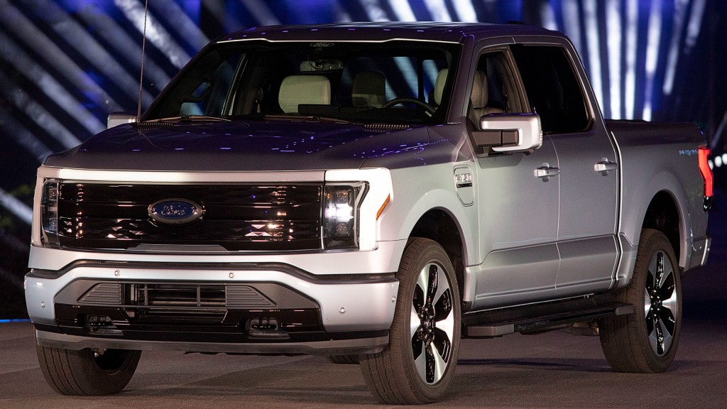 Silver new all-electric Ford F-150 Lightning performance pickup truck is revealed at a livestream event at Ford World Headquarters