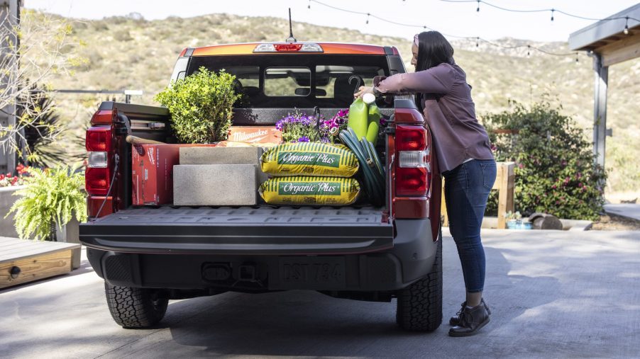 loading the Ford Maverick pickup bed full of landscaping supplies