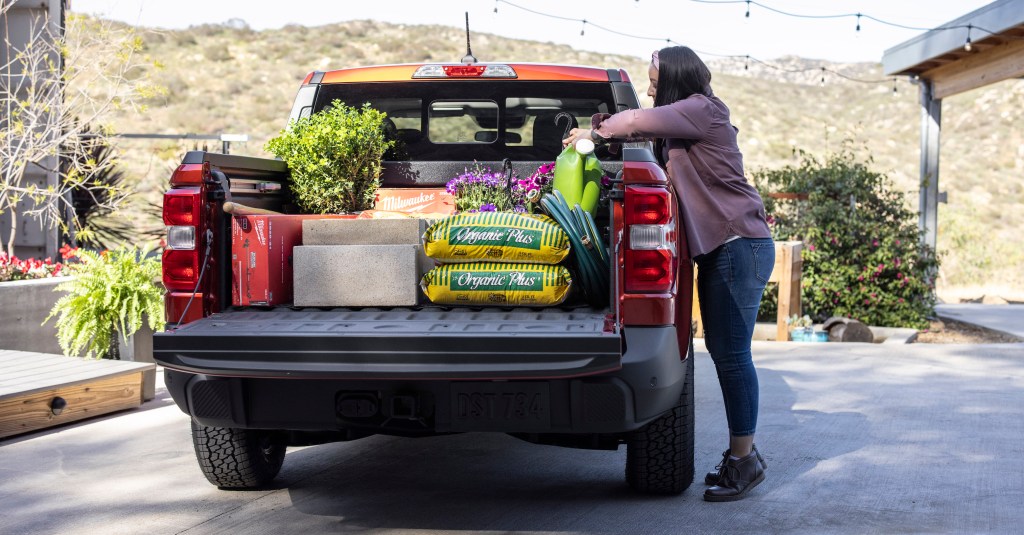 loading the Ford Maverick pickup bed full of landscaping supplies