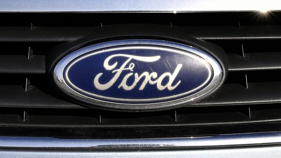 A blue oval Ford logo on a vehicle grille
