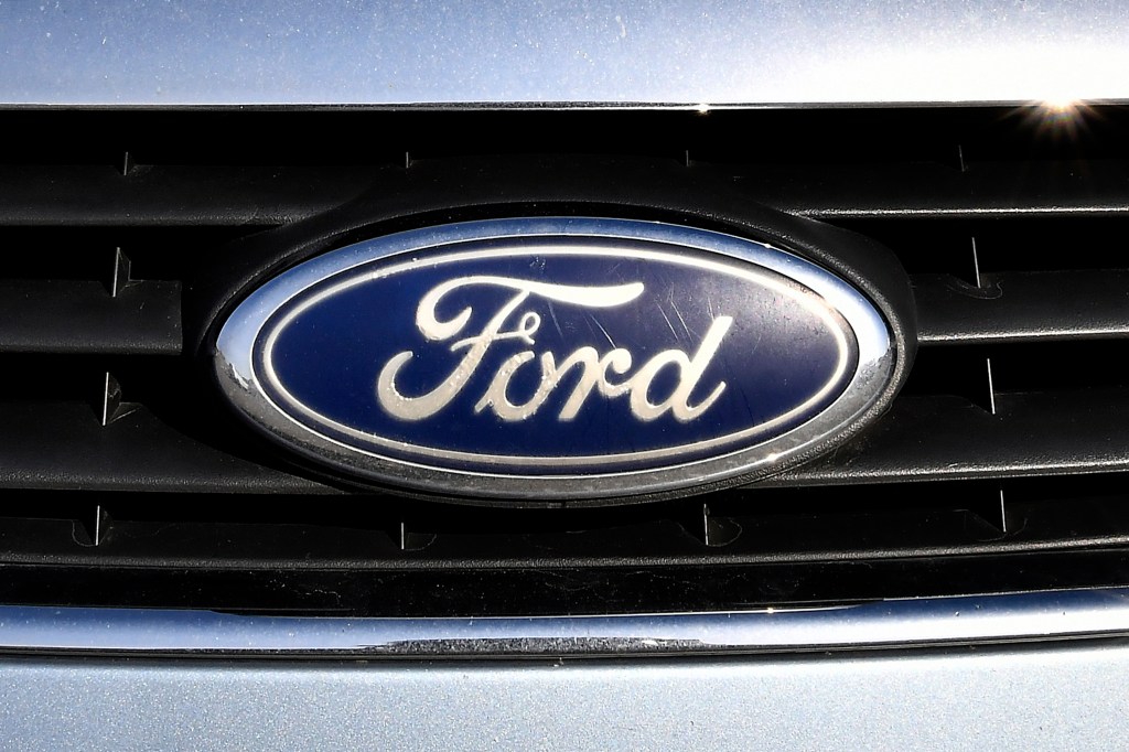 A blue oval Ford logo on a vehicle grille