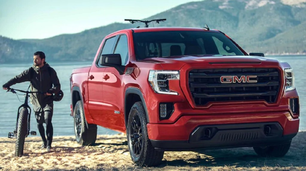 A red 2021 GMC Sierra parked in the mountains