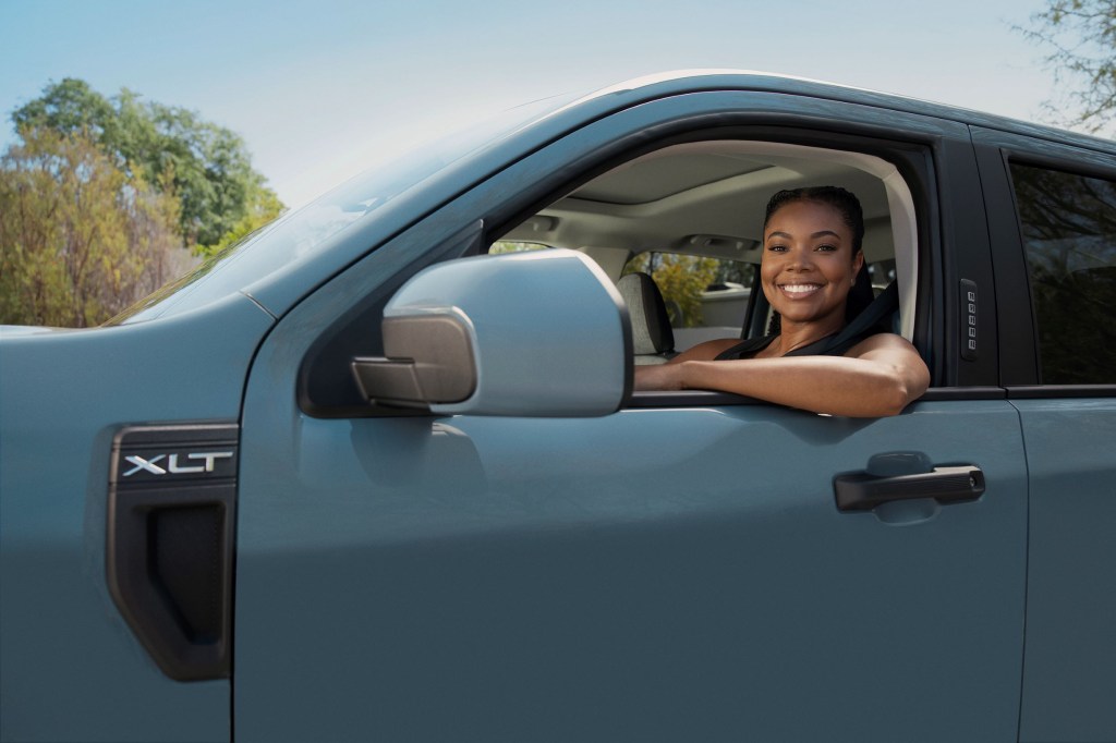 Gabrielle Union behind the wheel of a blue pre-production 2022 Ford Maverick