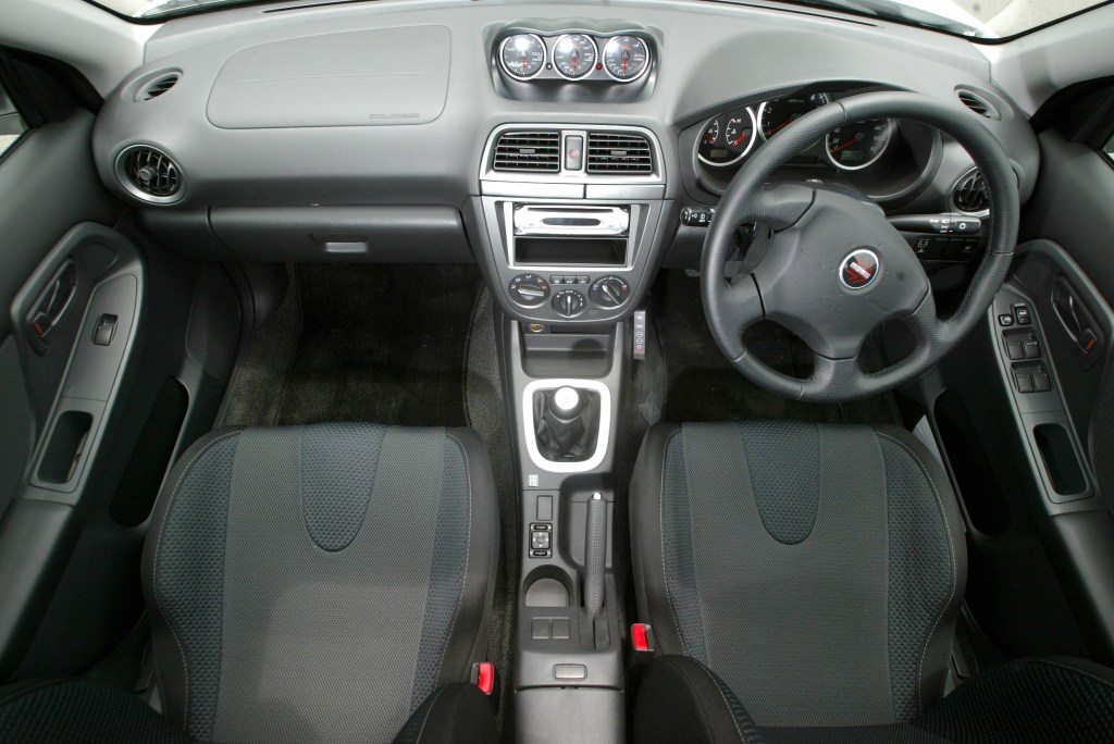 The interior of the Subaru WRX with a MOMO wheel