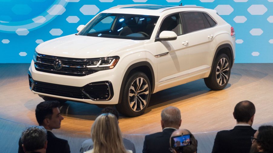 a white 2020 Volkswagen Atlas on display at an auto show