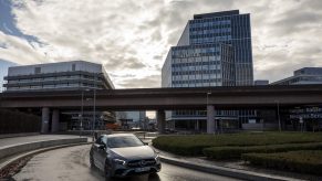 a mercedes-bens A-class driving in the city