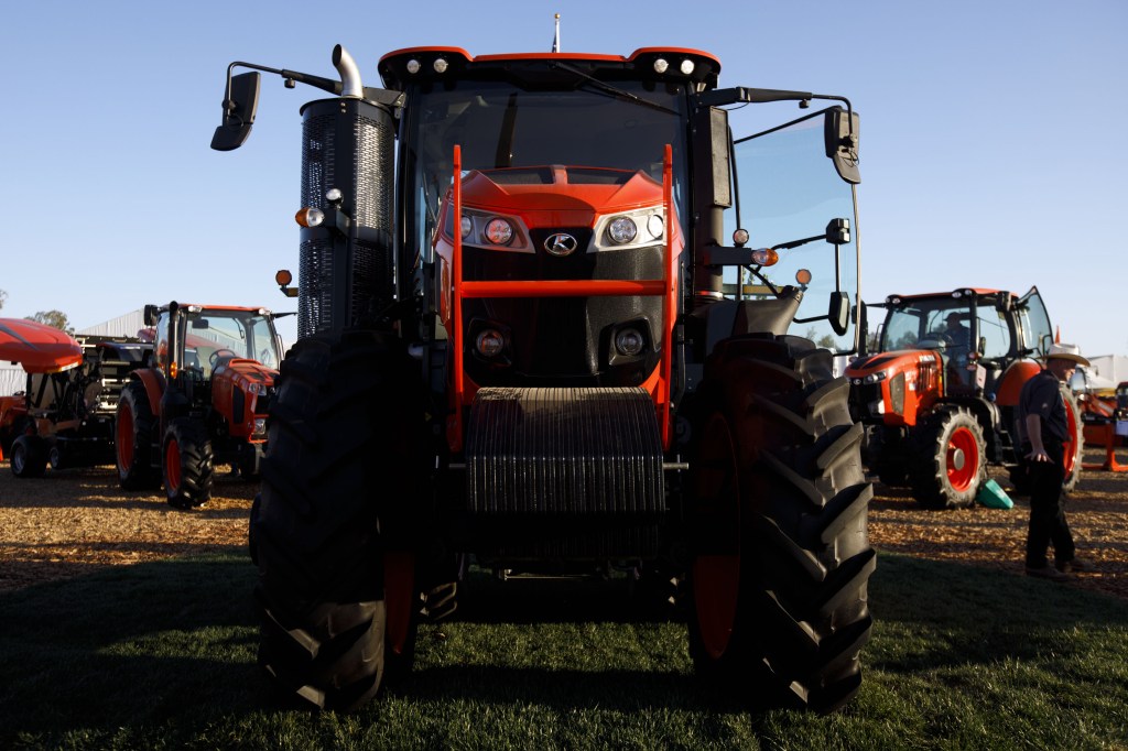 a large M8 tractor head on view in a field at a tractor convention 