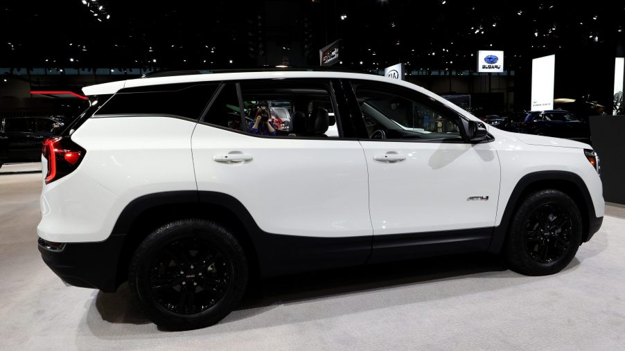 A white GMC Terrain in the booth at an auto show