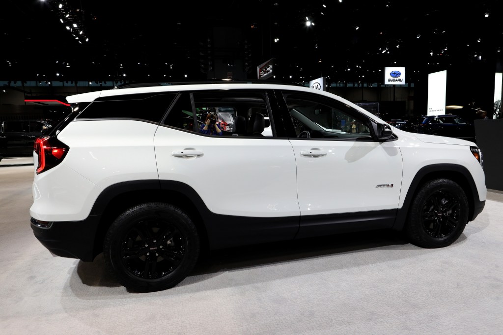 The 2021 GMC Terrain in white, photographed in profile