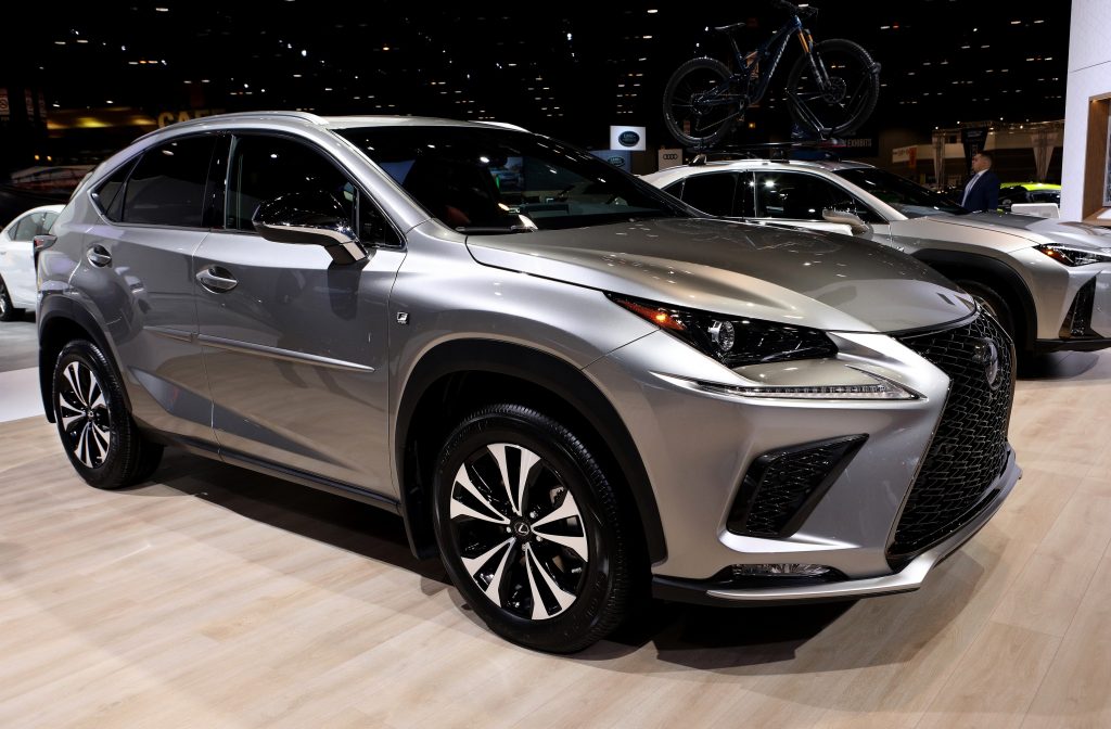 A silver Lexus NX 300 at an auto show