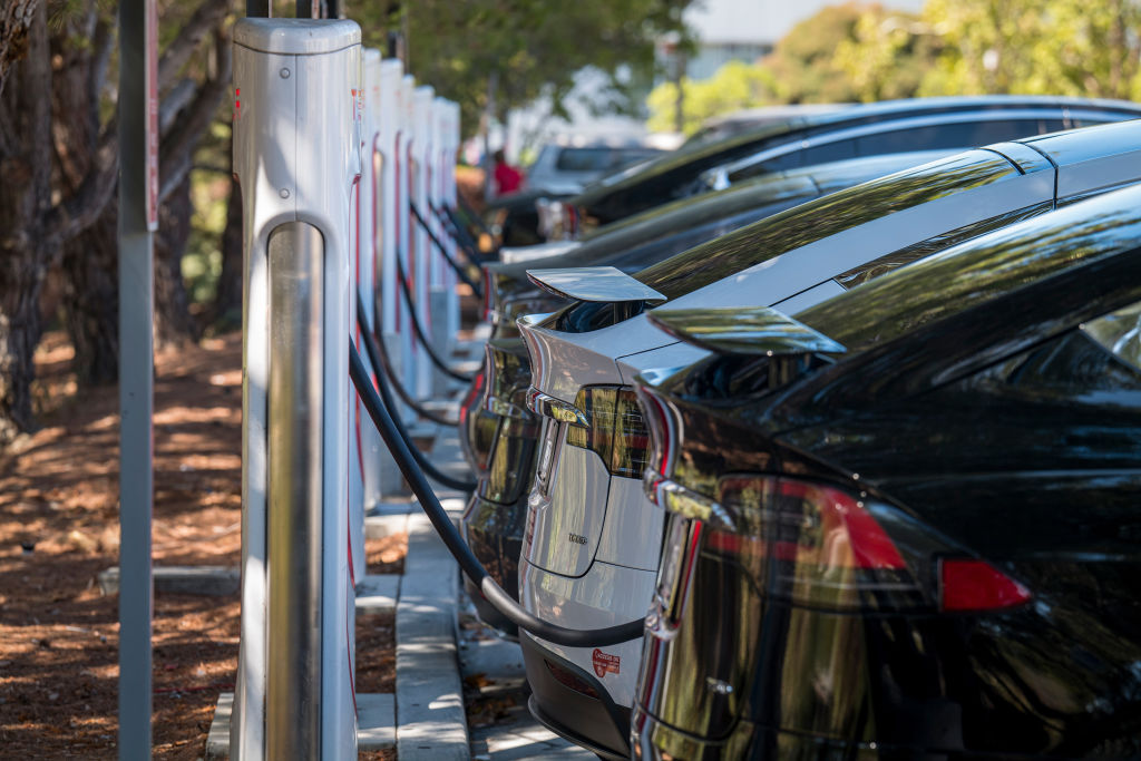 A row of Teslas charging in California