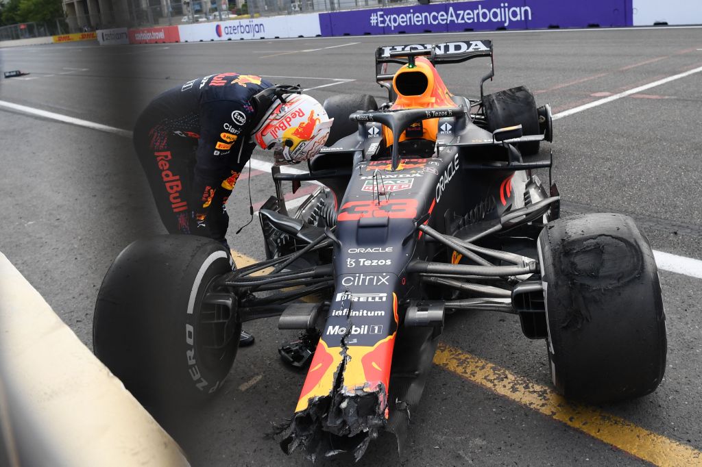 Verstappen hangs his head at his broken Pirelli-shod F1 car