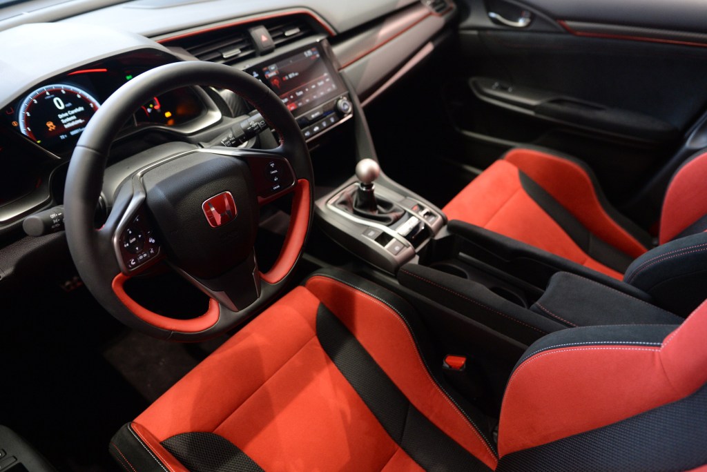 The red and black alcantara interior of the Honda Civic Type R