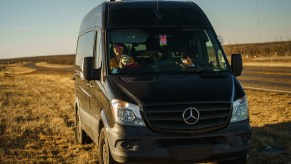 a black Mercedes-Benz Sprinter camper van conversion