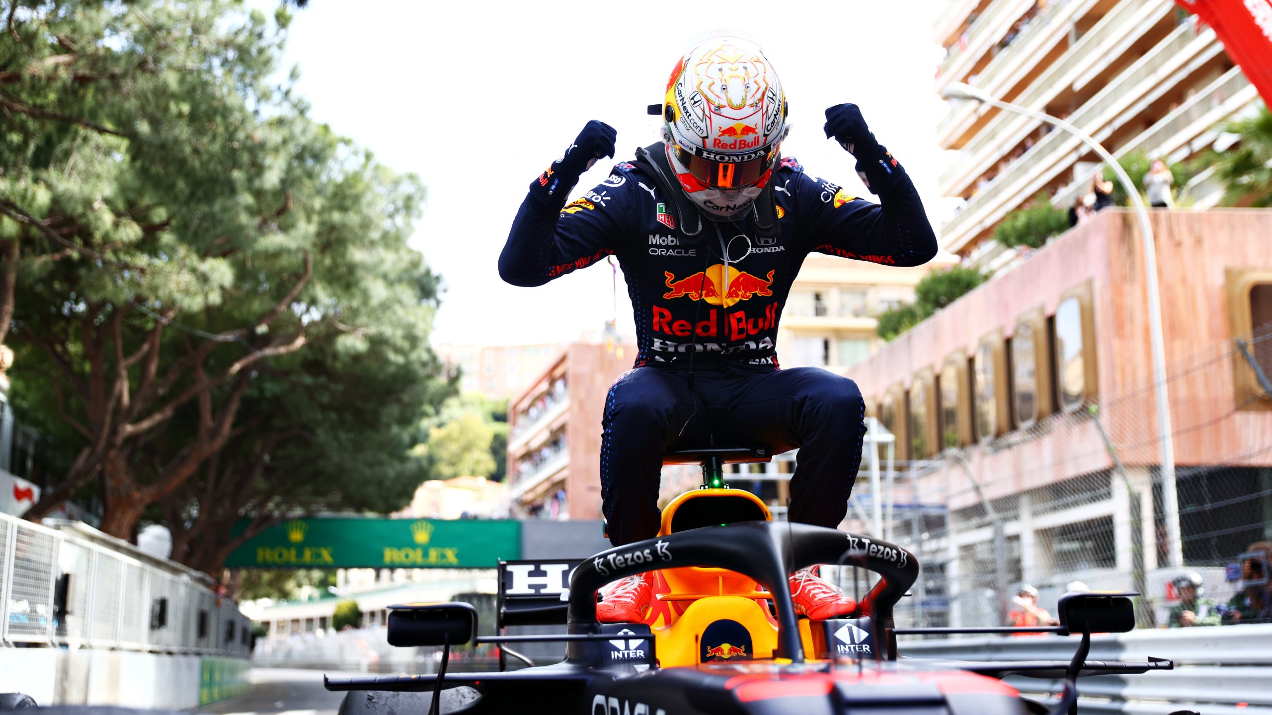 Max Verstappen sits on his Red Bull Formula 1 car after winning a race