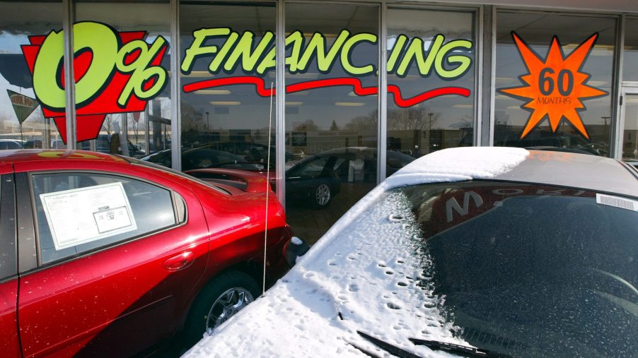 A car dealership advertising car loans in the window