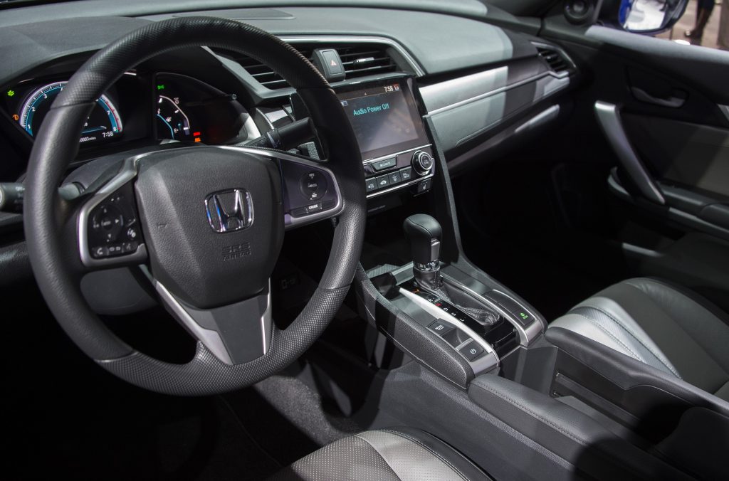 The black-on-black interior of a Honda Civic