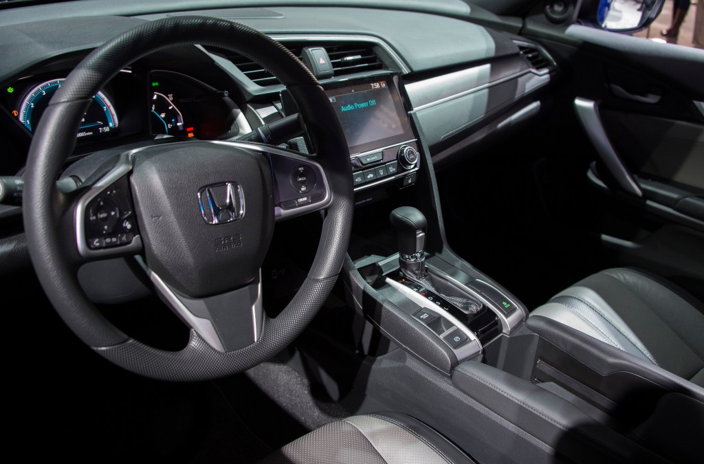 The black-on-black interior of a Honda Civic