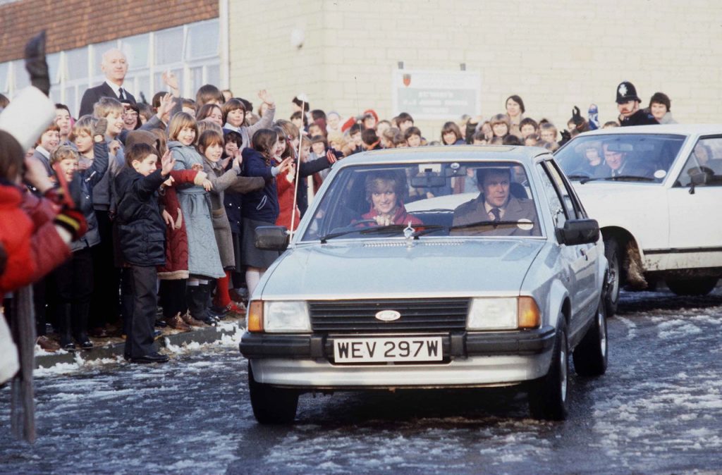An image of Princess Diana driving her Ford Escort.
