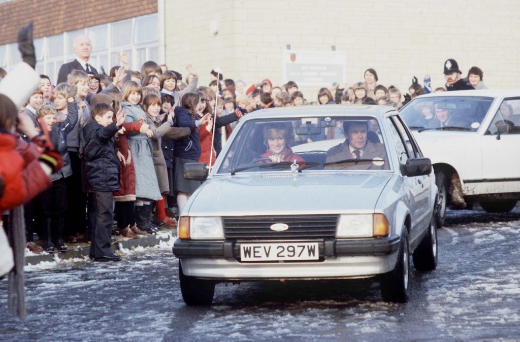 An image of Princess Diana driving her Ford Escort.