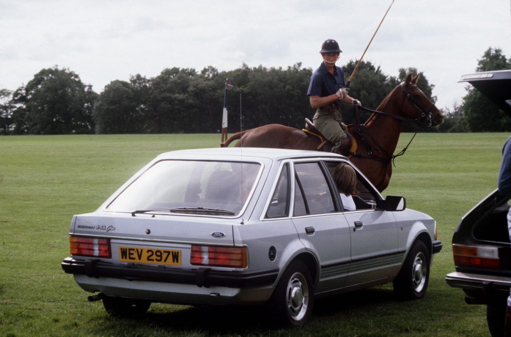 An image of Princess Diana driving her Ford Escort.