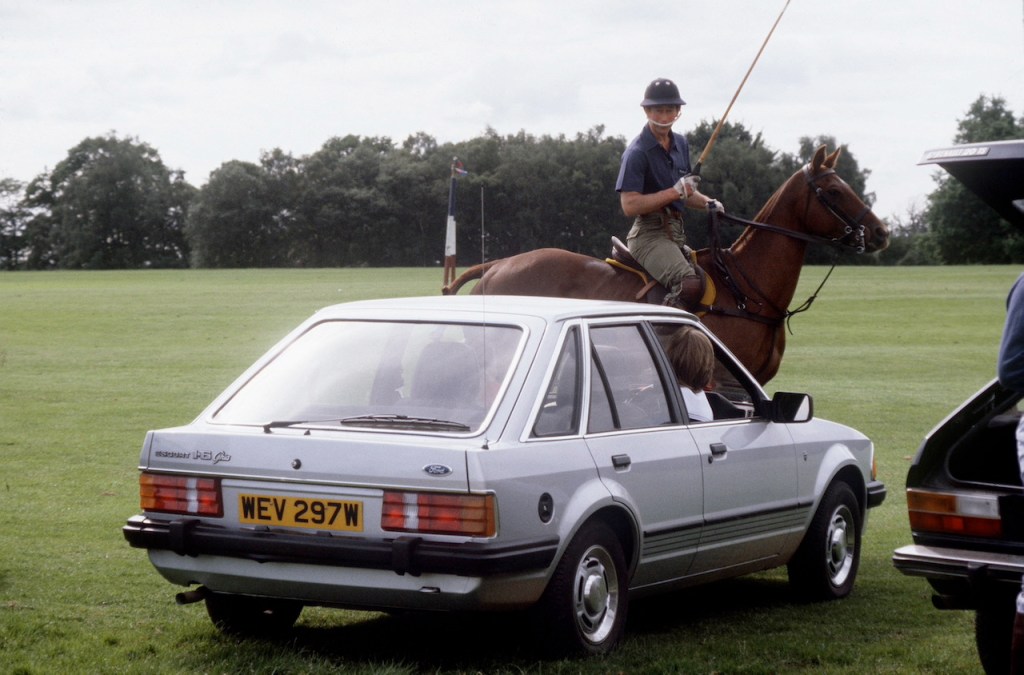 An image of Princess Diana driving her Ford Escort.