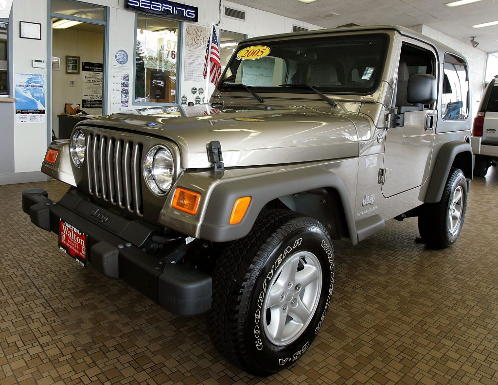 A silver 2005 Wrangler at a dealership