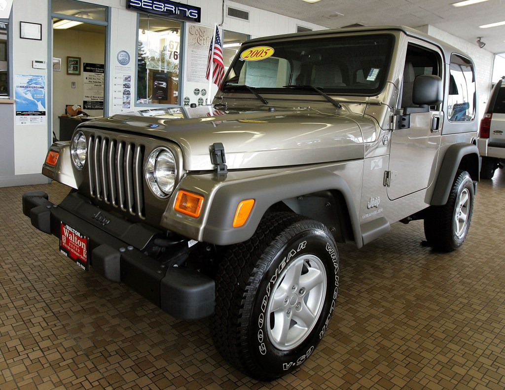 A silver 2005 Wrangler at a dealership