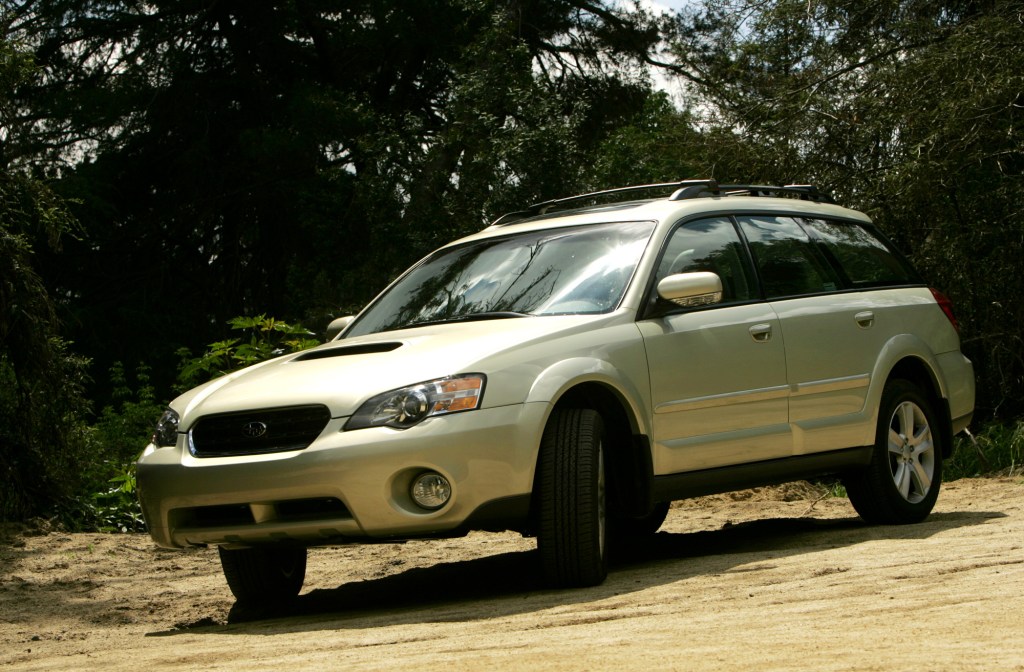 A green Outback on a trail