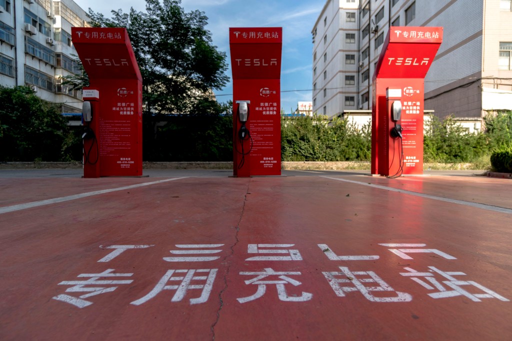 Red Tesla charging stations on a street in China