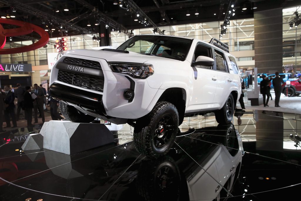 A white Toyota 4Runner on display at an auto show