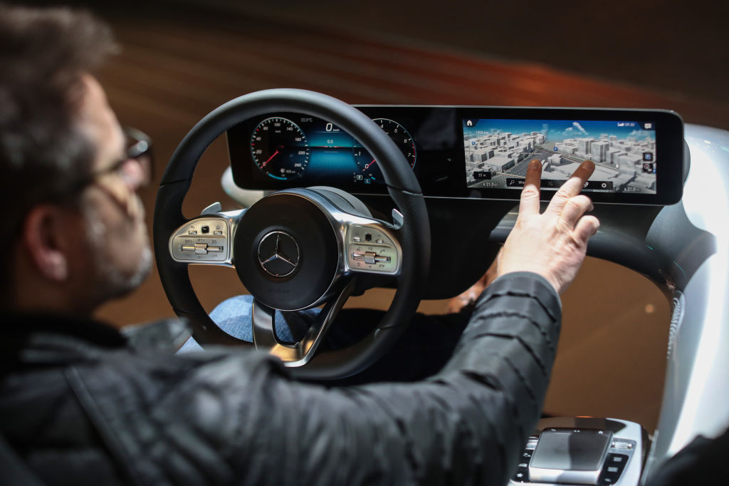 A man demos Mercedes' new MBUX infotainment in 2018