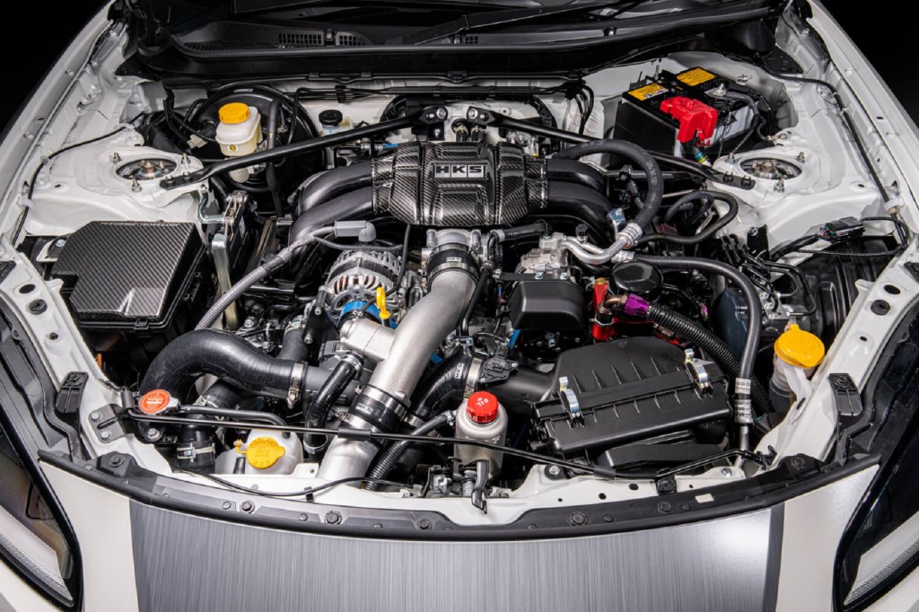 The engine bay of the HKS Toyota GR 86 Concept showing the supercharger kit