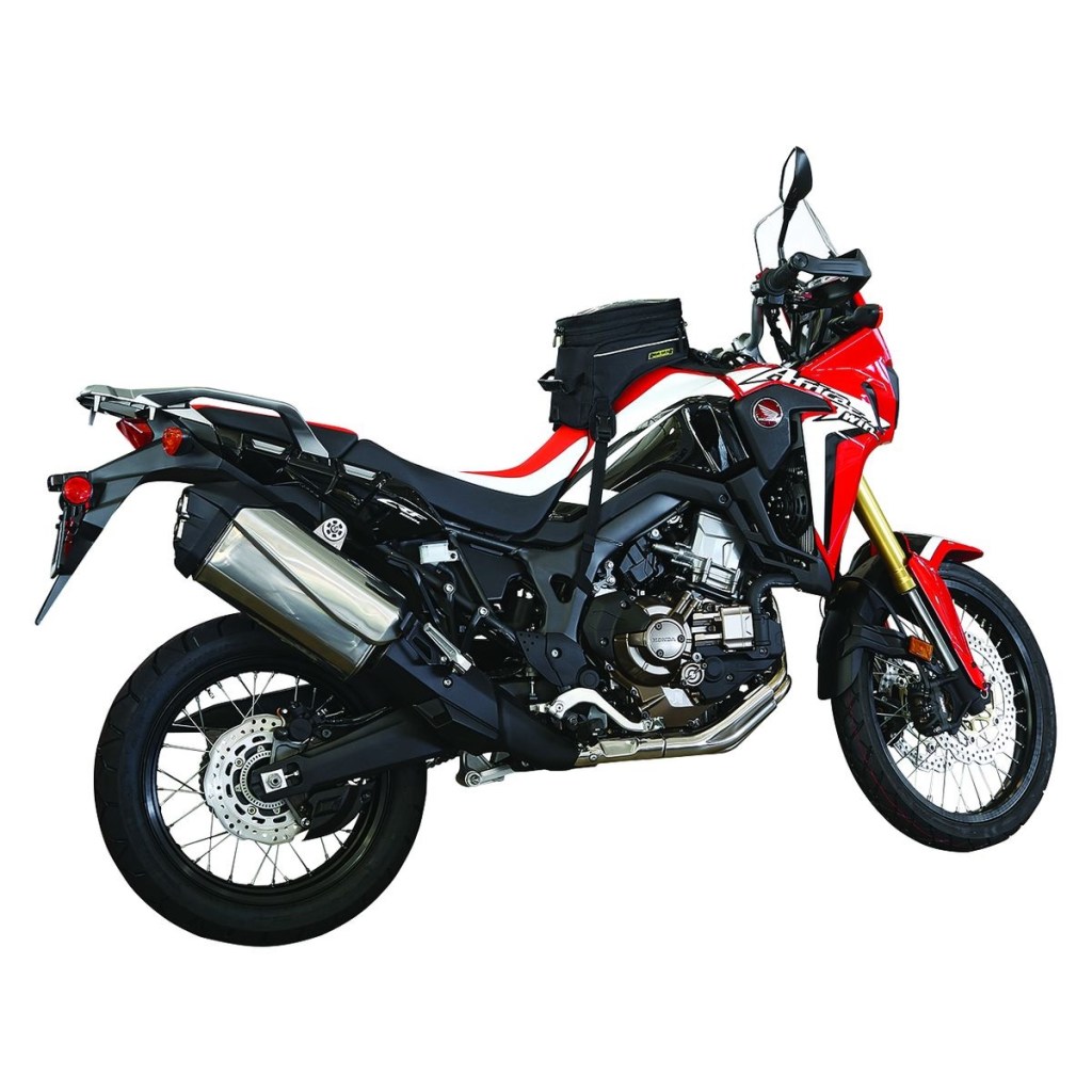 A red-and-white Honda Africa Twin with a black Nelson Rigg Trails End Adventure motorcycle tank bag