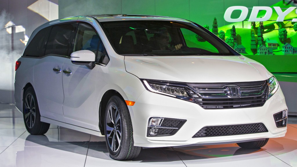 A white Honda Odyssey minivan vehicle sits on display during the 2017 North American International Auto Show.