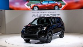 A black Honda Passport AWD Sport is on display at the Chicago Auto Show.