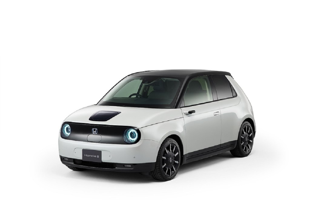 A white UK Honda e against a white background.