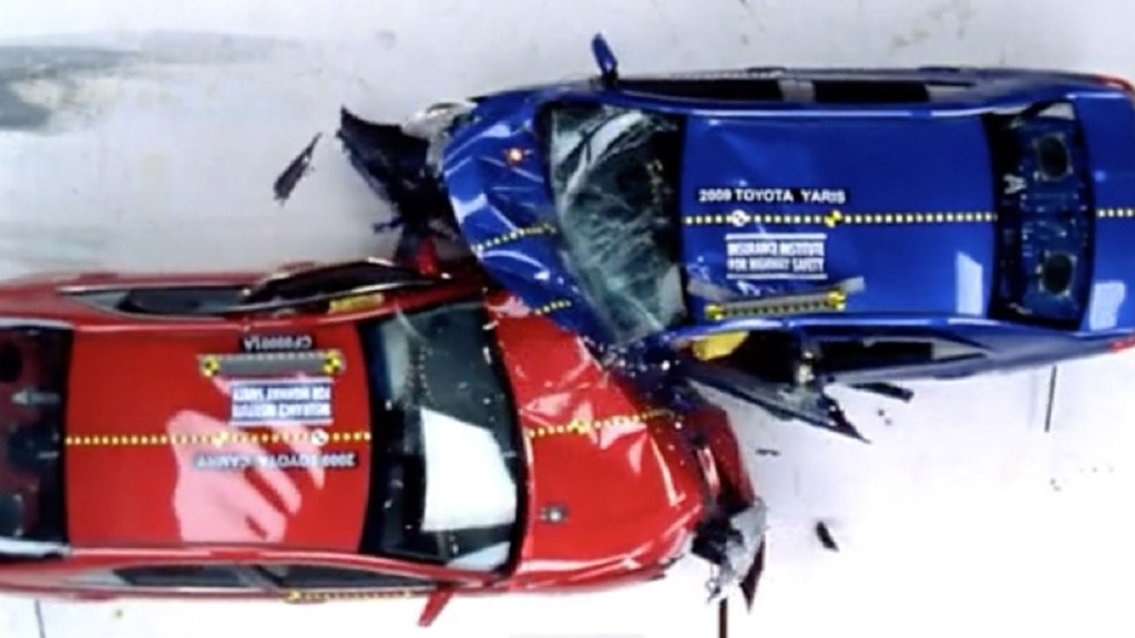 The front left corners of a red car and a blue car collide. 
