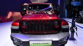 A red Jeep Motor Wrangler 4xe car is on displayed during the 19th Shanghai International Automobile Industry Exhibition