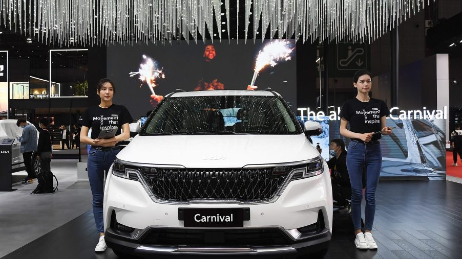 A white Kia Motor Carnival car is on displayed during the 19th Shanghai International Automobile Industry Exhibition