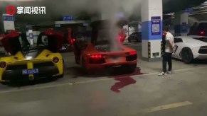 The Lamborghini owner watches as his car goes up in smoke