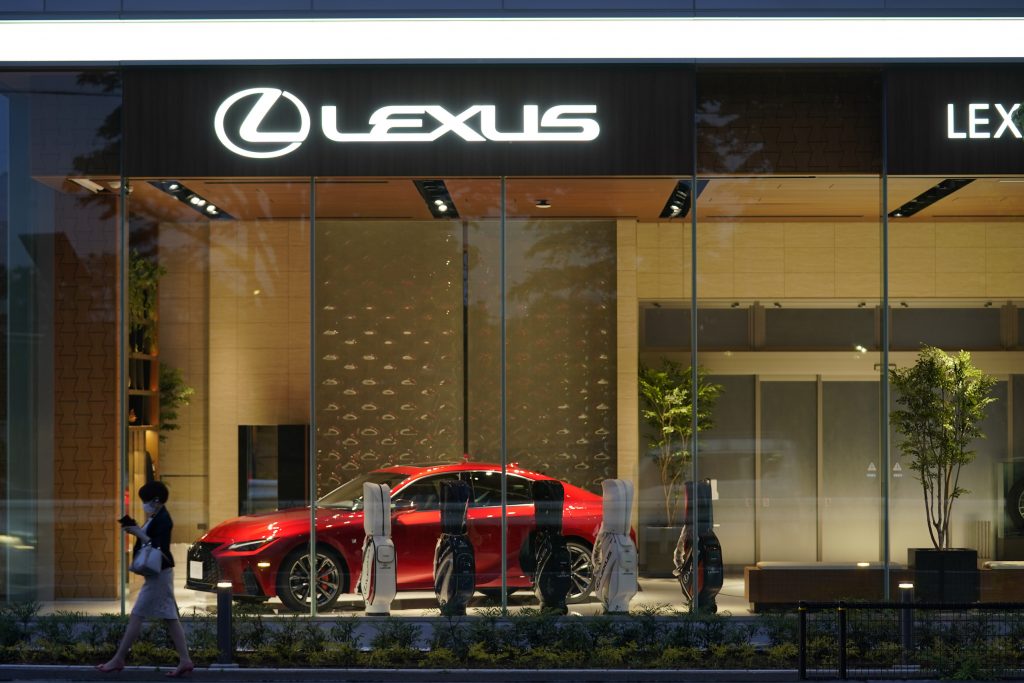 A red Toyota Motor Corp. Lexus IS300 sedan at a Lexus dealership in Tokyo, Japan